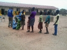 Beneficiaries waiting to receive the items._1
